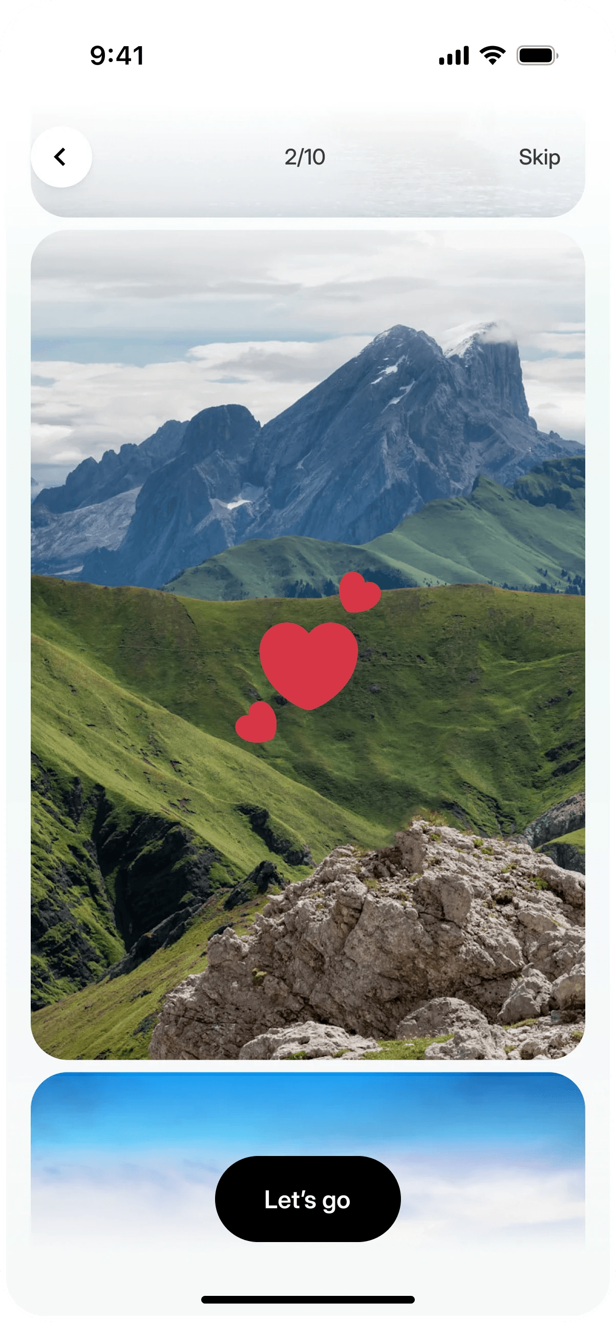 Onboarding photo picks: a mountain landscape liked with hearts, step 2 of 10